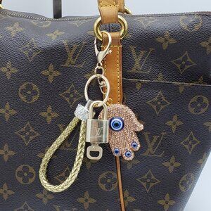 Authentic Louis Vuitton Lock & Key with unbranded Evil Eye Bagcharm 011526